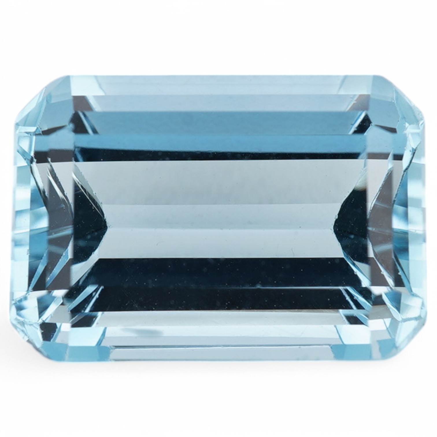 An unmounted emerald cut aquamarine, weighing approximately 6.00ct, in a fitted gilt tooled leather box by Francelino Horta Junior, Rio De Janeiro. Condition - fair to good